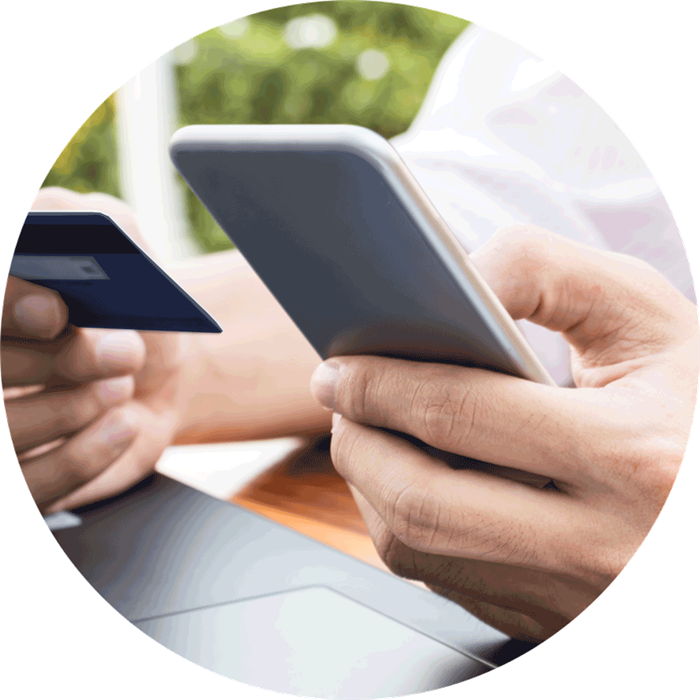 a laptop, a card and a cellphone 
