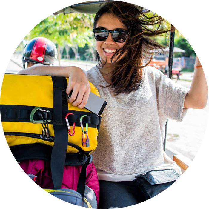 a woman with her hand on luggage